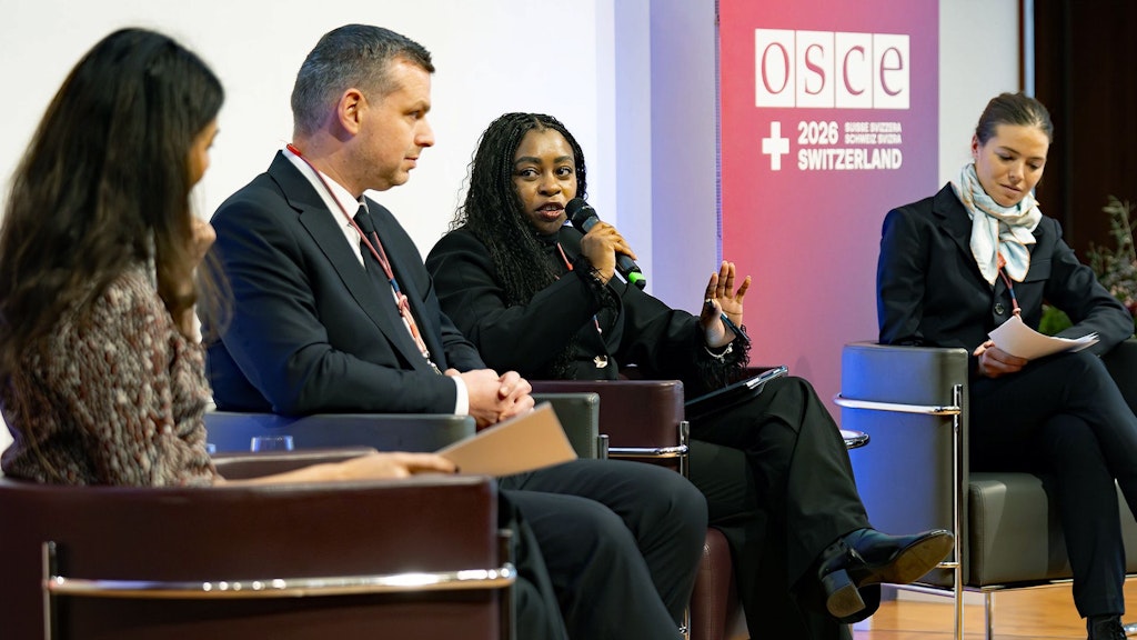 Four people speak on stage at the conference on combating anti-Semitism in St. Gallen.