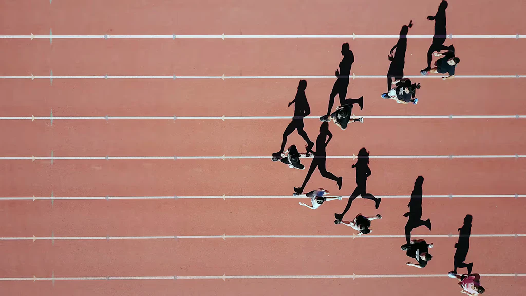 Image showing eight athletes on a racetrack, symbolising the world of sport.