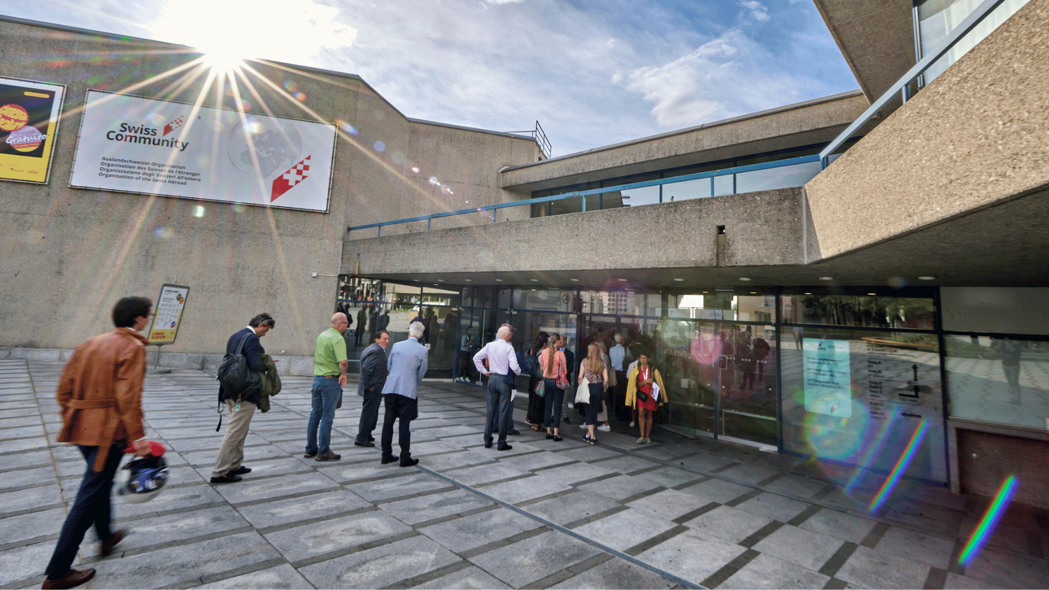 People queueing to enter a building.