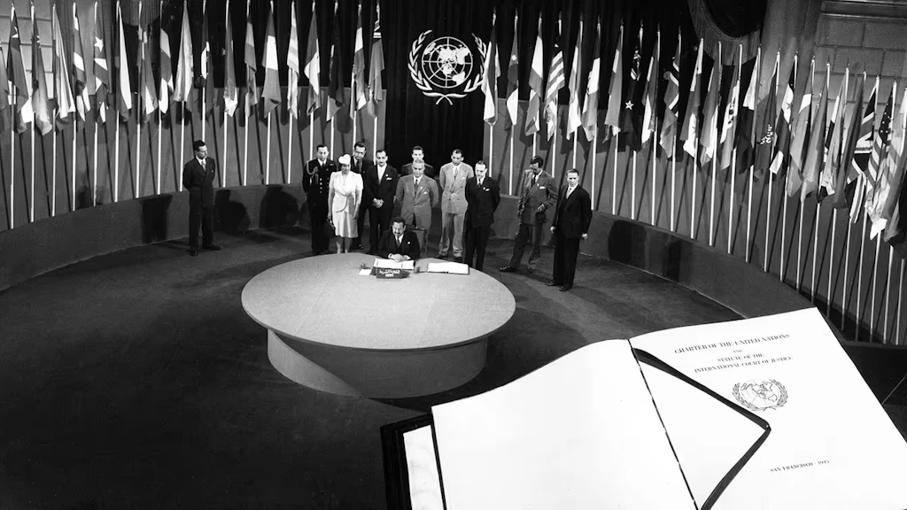 Egypt signing the UN Charter, with the Charter in the foreground. 