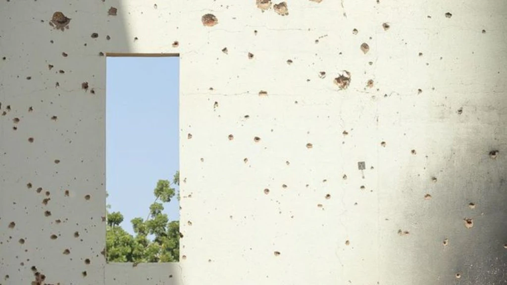 Traces of street fighting on a wall in Khartoum. 