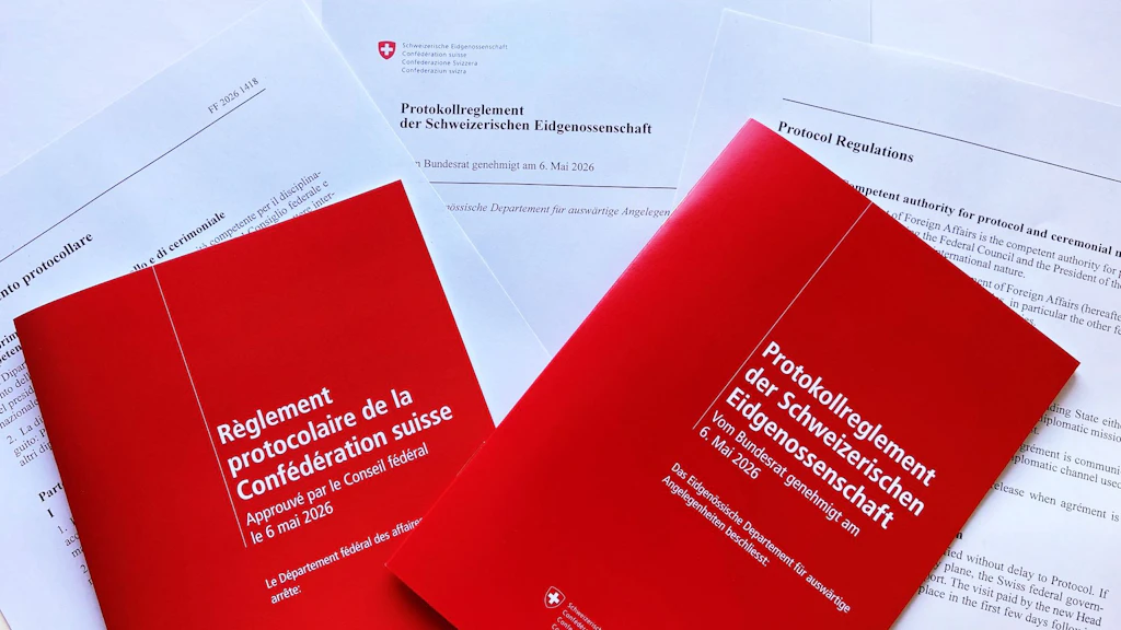 Two red sets of Protocol Regulations on printed sheets.