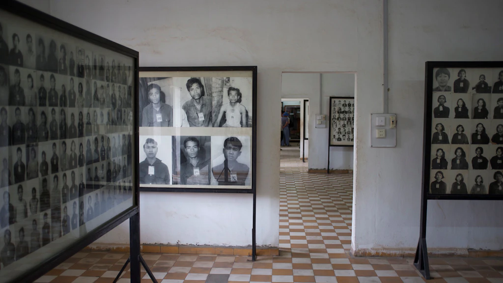 Black and white photos of torture victims in the Tuol Sleng Genocide Museum in Phnom Phen, Cambodia.