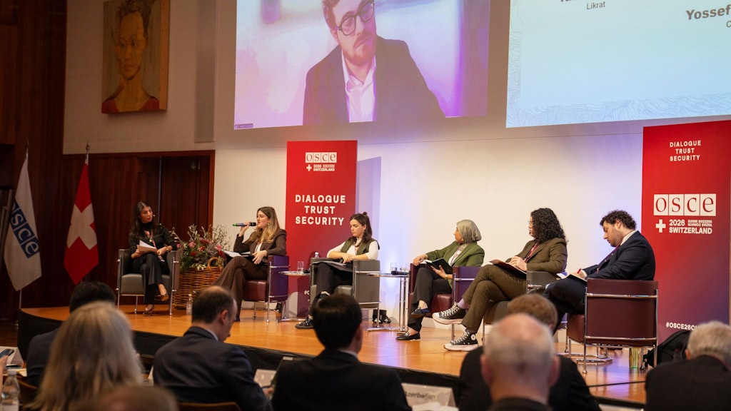 Six people speak on stage at the anti-Semitism conference in St. Gallen.