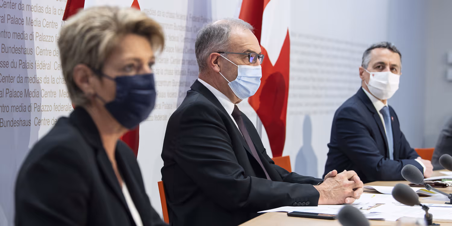 President of the Swiss Confederation Guy Parmelin, Federal Councillor Ignazio Cassis and Federal Councillor Karin Keller-Sutter speaking on the panel of a press briefing at the Media Centre in Berne.