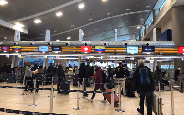 At Mariscal Sucre International Airport on April 3, passengers on the Quito-Zurich flight check-in. 
