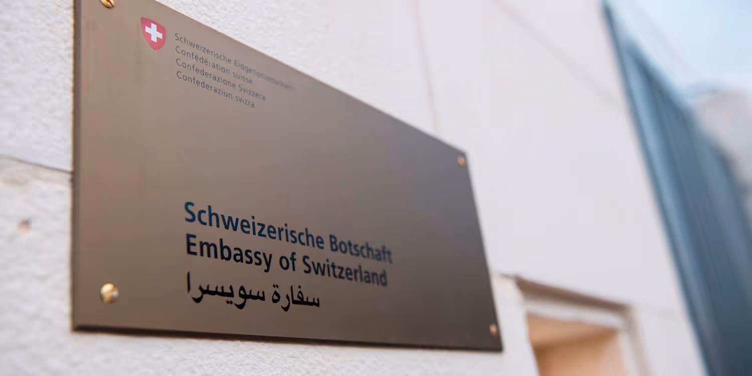 Embassy of Switzerland' sign in German, English and Arabic.