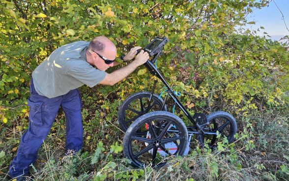 Ground-penetrating radar collects geophysical data.