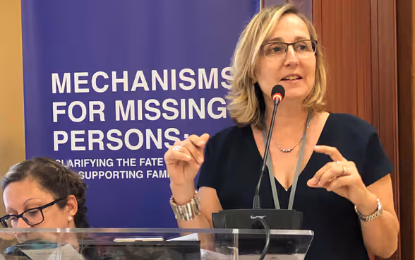 Caroline Douilliez-Sabouba, head of the Missing Persons Project of the International Committee of the Red Cross, at the lectern. 