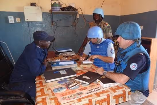 Police officers sitting around a table and talking