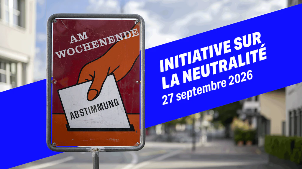 Photo d'un panneau métallique sur lequel on peut lire «Votation ce week-end».